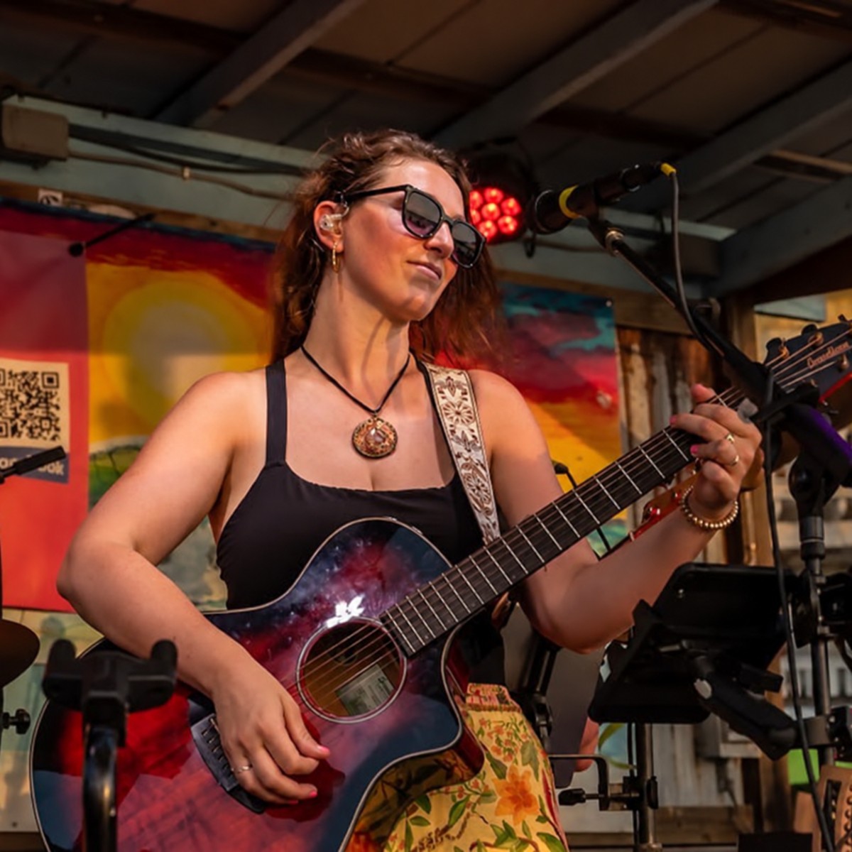 Collete Campbell performing on guitar